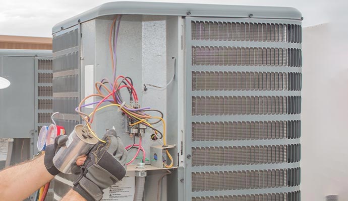 Professional technician performing AC maintenance service