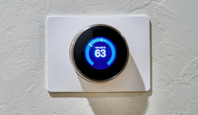 Installed thermostat on the wall