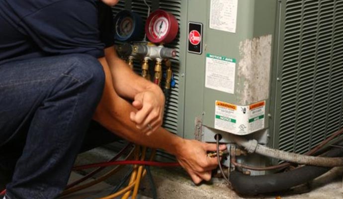 Person repairing outdoor AC