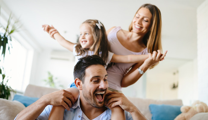 Happy family enjoying fresh indoor air Happy family enjoying fresh indoor air