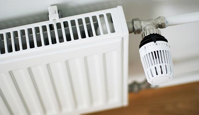 Newly installed radiator mounted on the ceiling for heating