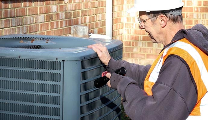 An expert technician inspecting a heating system