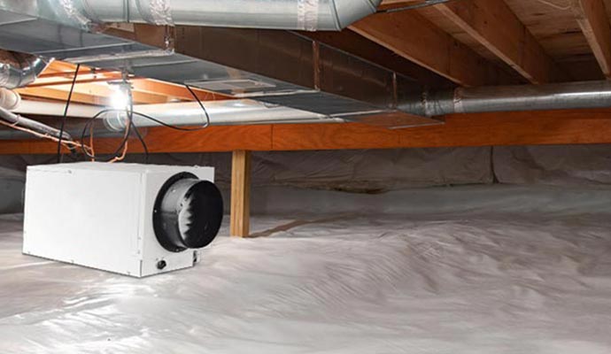 Installed dehumidifier in wooden crawlspace